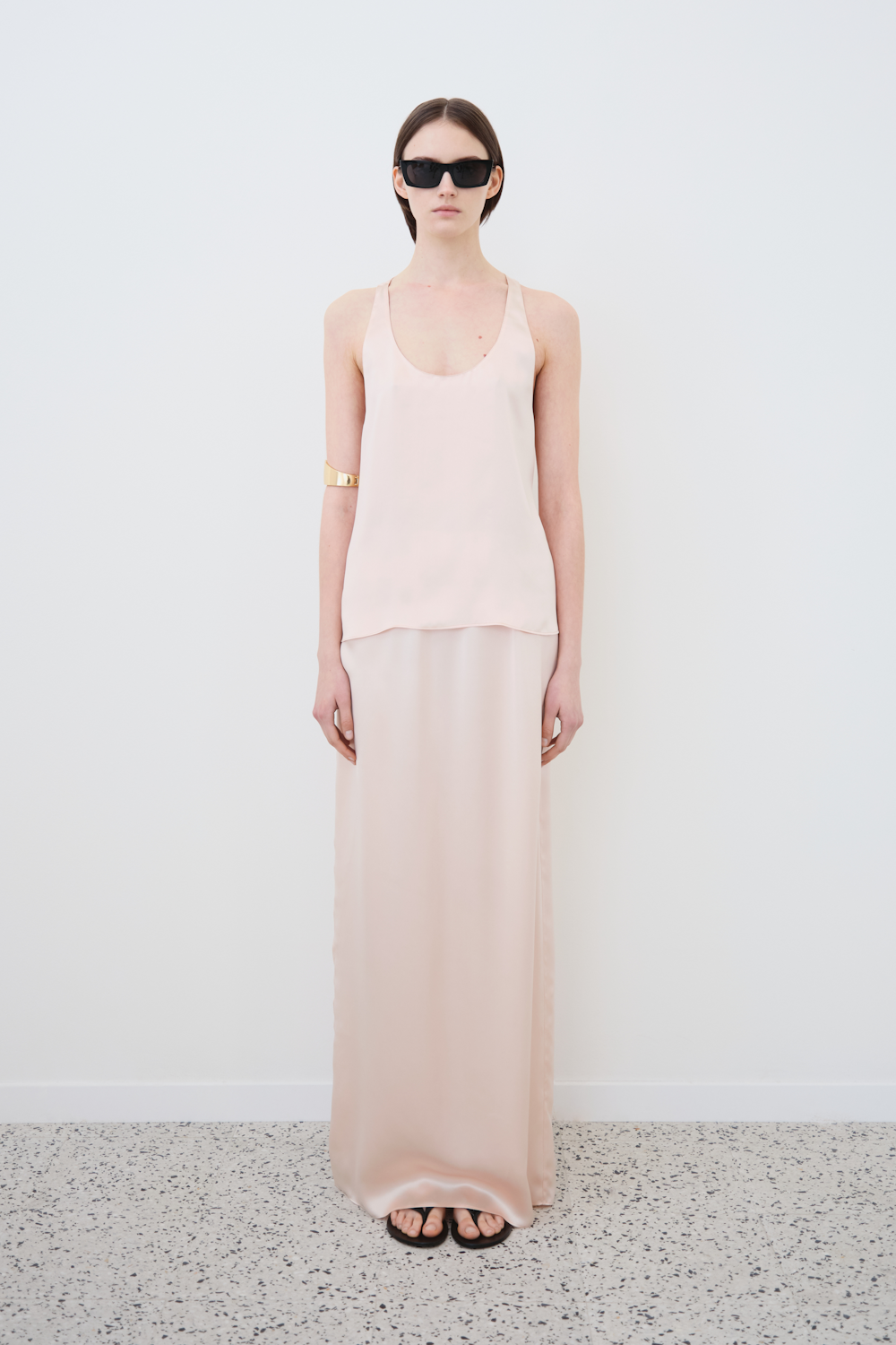 Front view of the Nilde maxi skirt in Whisper Pink by HERTH, styled with the Eda top — a sustainable womenswear silk outfit for a timeless wardrobe.