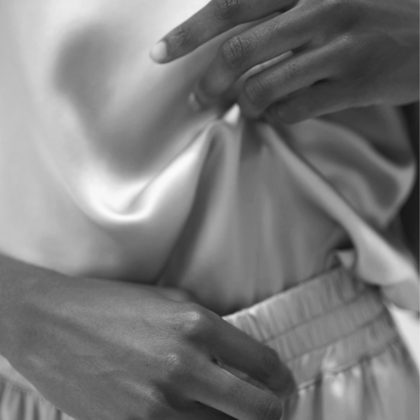 Detail of HERTH organic silk garment crafted from GOTS-certified suppliers, soft and sustainable fabric in Italy.