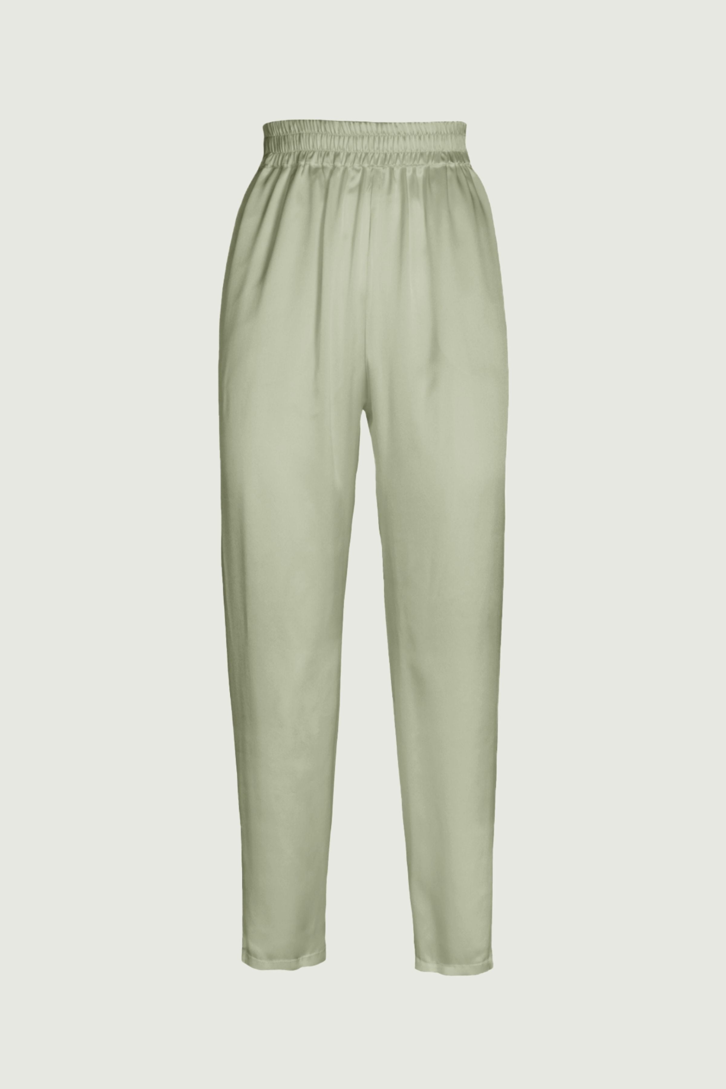 Tea green organic silk trousers with high waist and tapered leg, elastic waistband and fluid drape, minimalist silhouette, front view