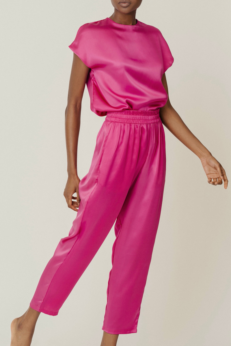 Hot pink silk set featuring Cora top and Roy trousers — bold and refined coordinated womenswear look in GOTS-certified silk by HERTH.