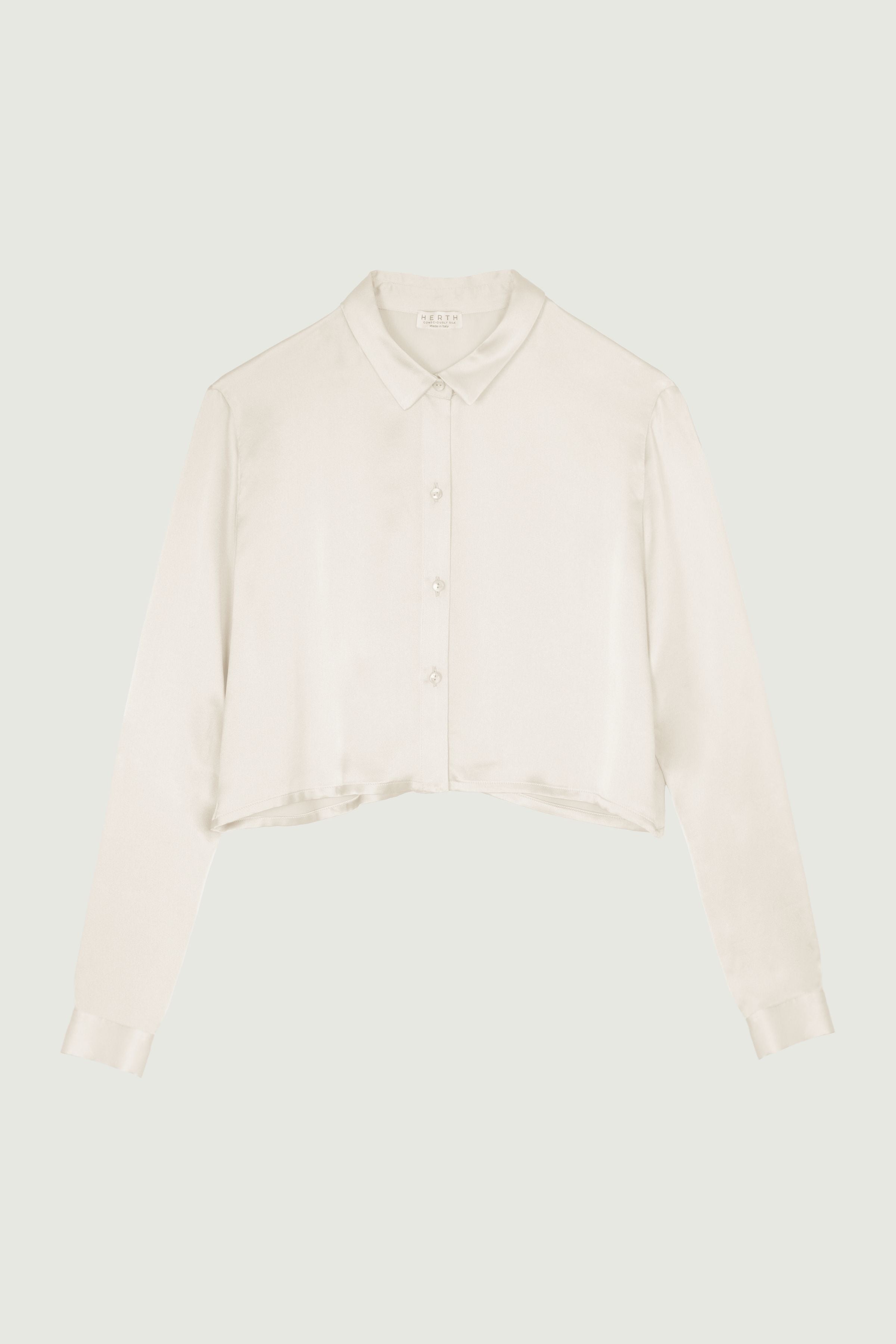 Almond cropped silk shirt with long sleeves and button front, relaxed fit and soft fluid drape, modern short-length silhouette