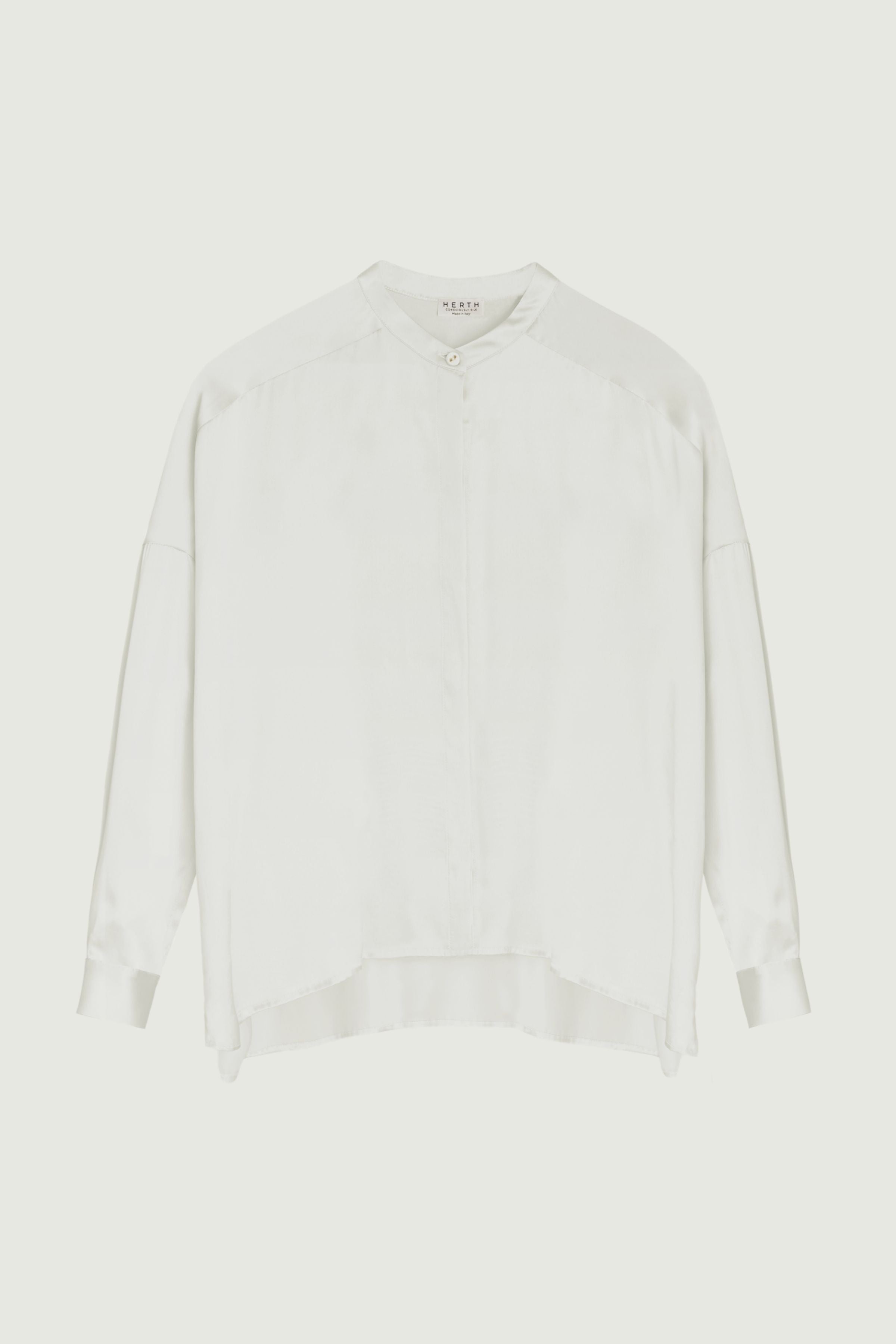 Ivory silk shirt with mandarin collar, relaxed fit and clean concealed placket, fluid drape and minimal silhouette, front view