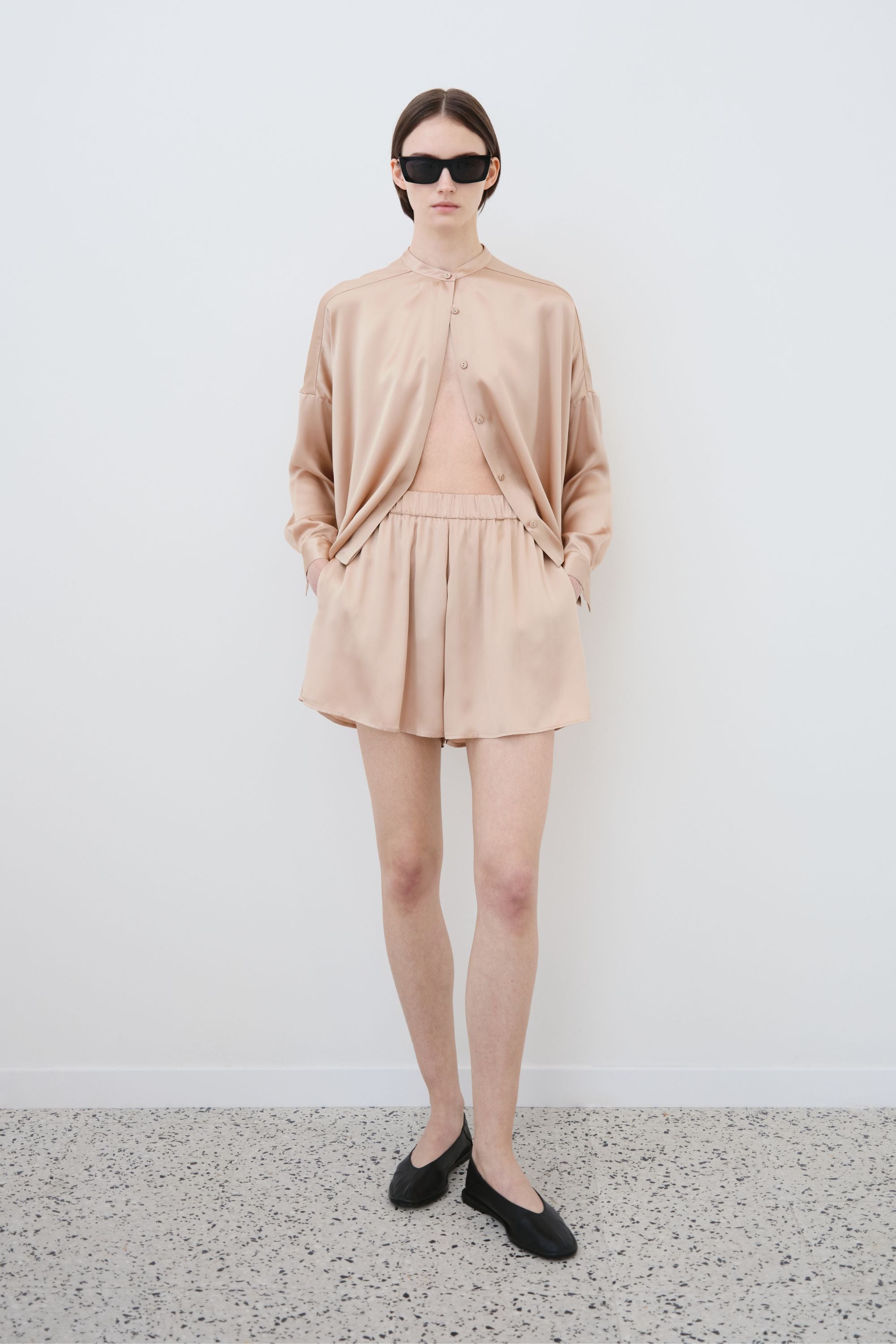 Model wearing organic silk shirt and shorts set, Tess shirt and Hani shorts made in Italy, front view