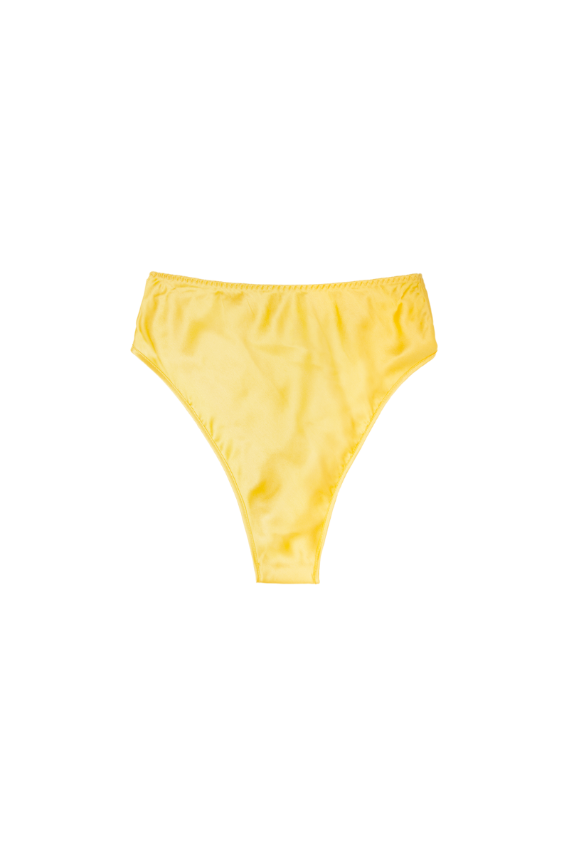 High-rise panty in Mango — Thea by HERTH. Crafted in GOTS-certified organic silk for sustainable softness and everyday comfort.