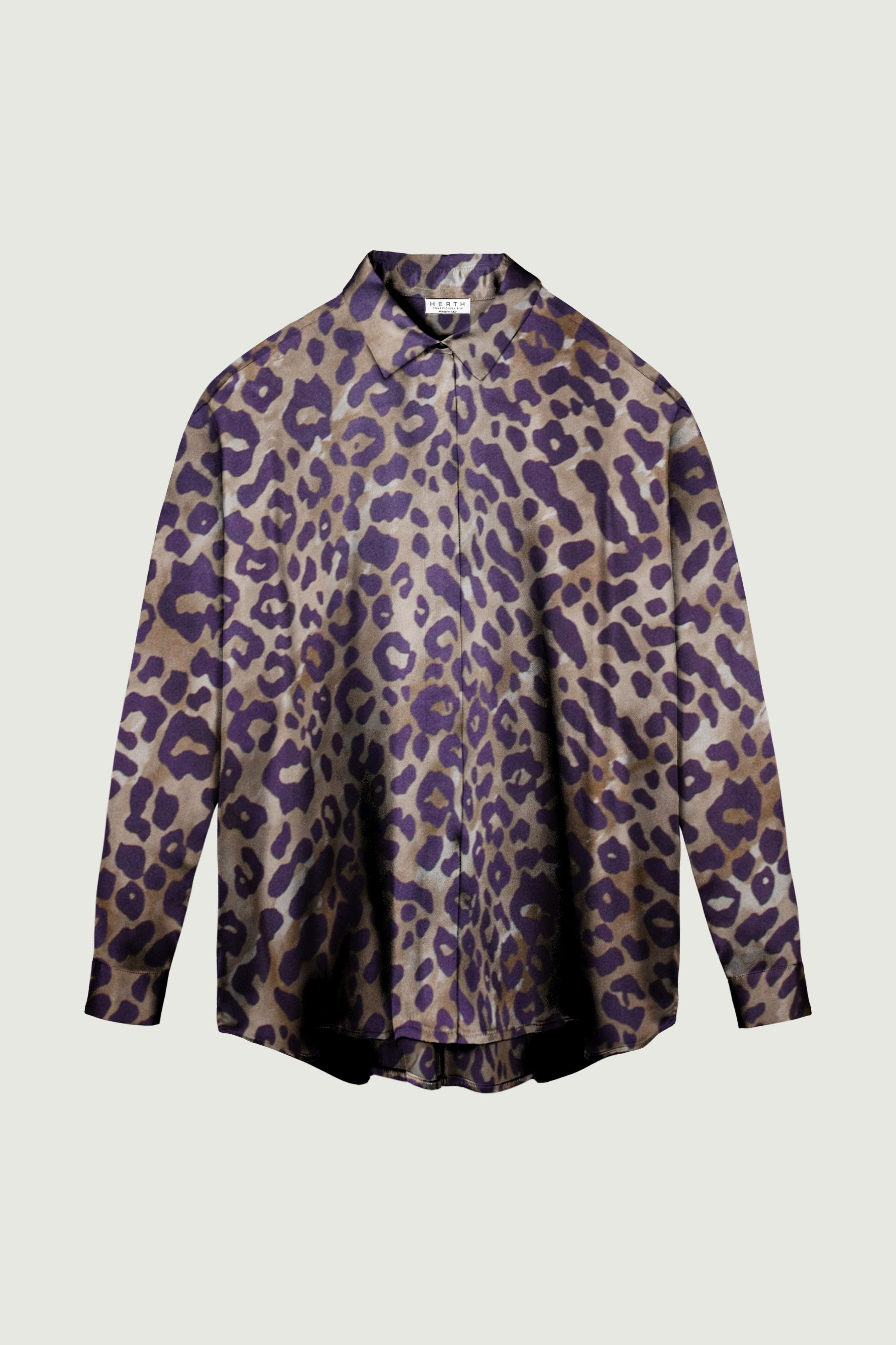 Leopard print silk shirt with relaxed fit, long sleeves and button-down front, fluid drape and bold patterned silhouette
