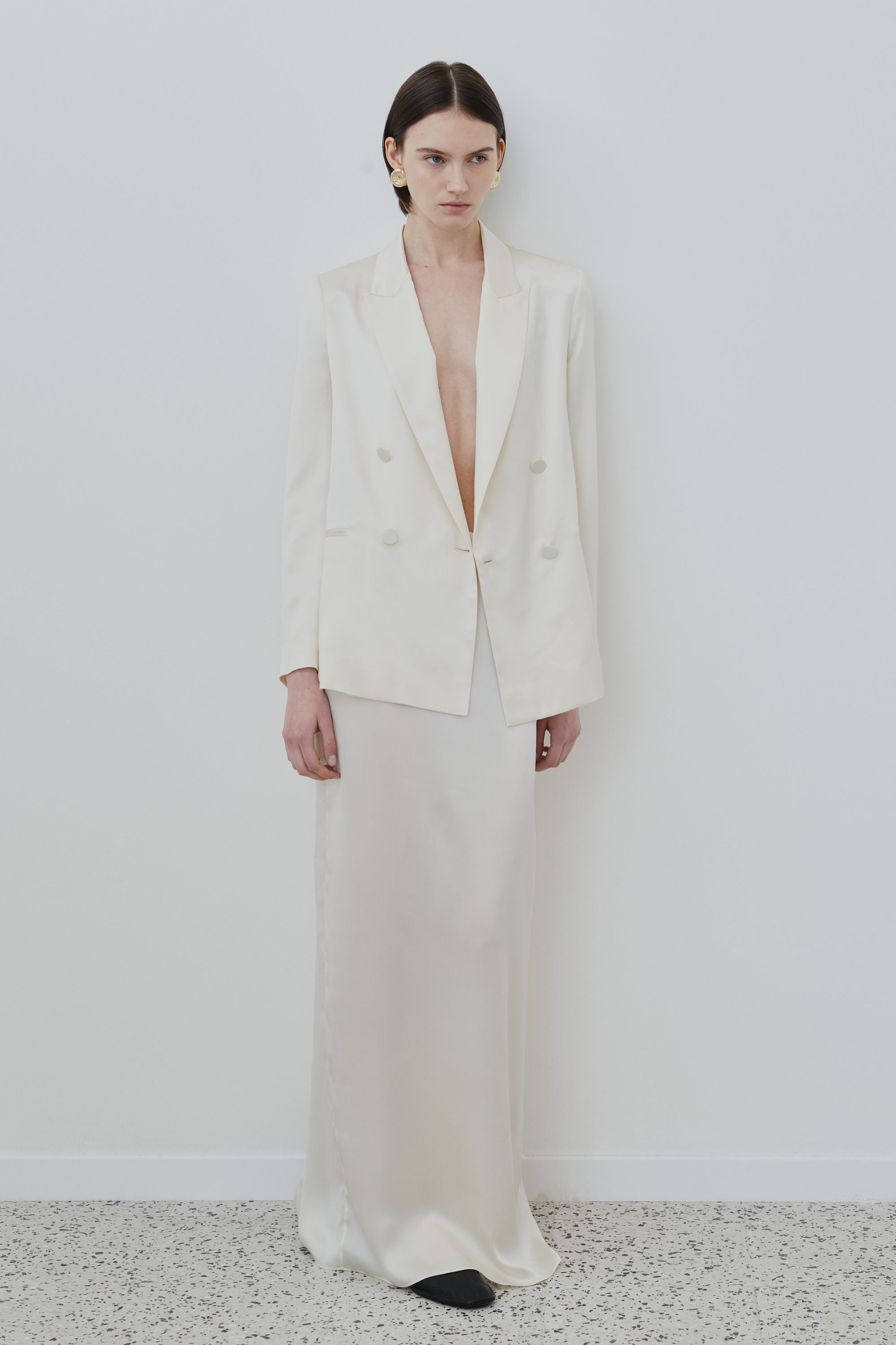 Model wearing organic silk blazer and skirt set in almond, Uma blazer and Nilde skirt made in Italy, front view