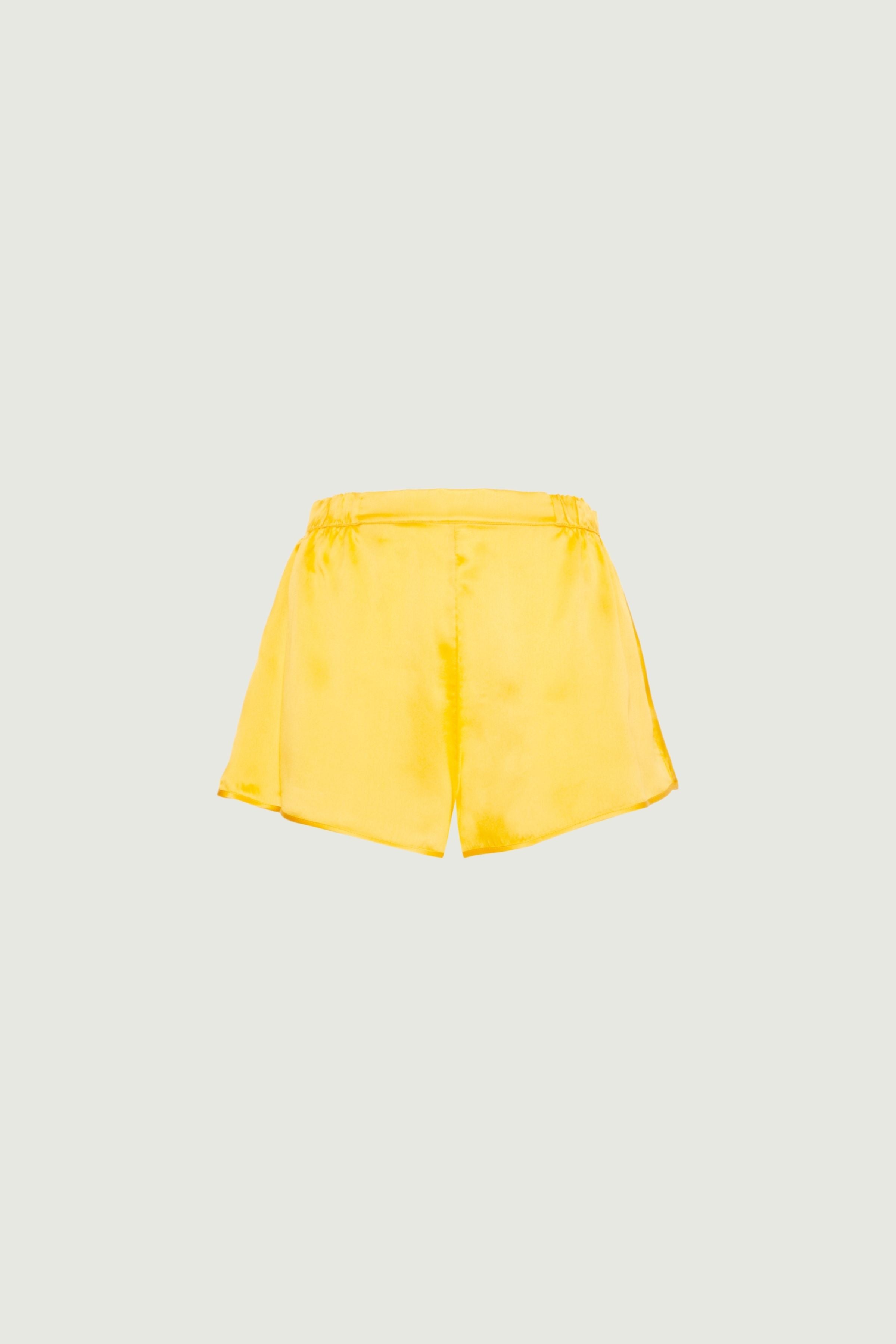 Mango organic silk shorts with elastic waistband and relaxed fit, smooth texture and fluid silhouette, front view