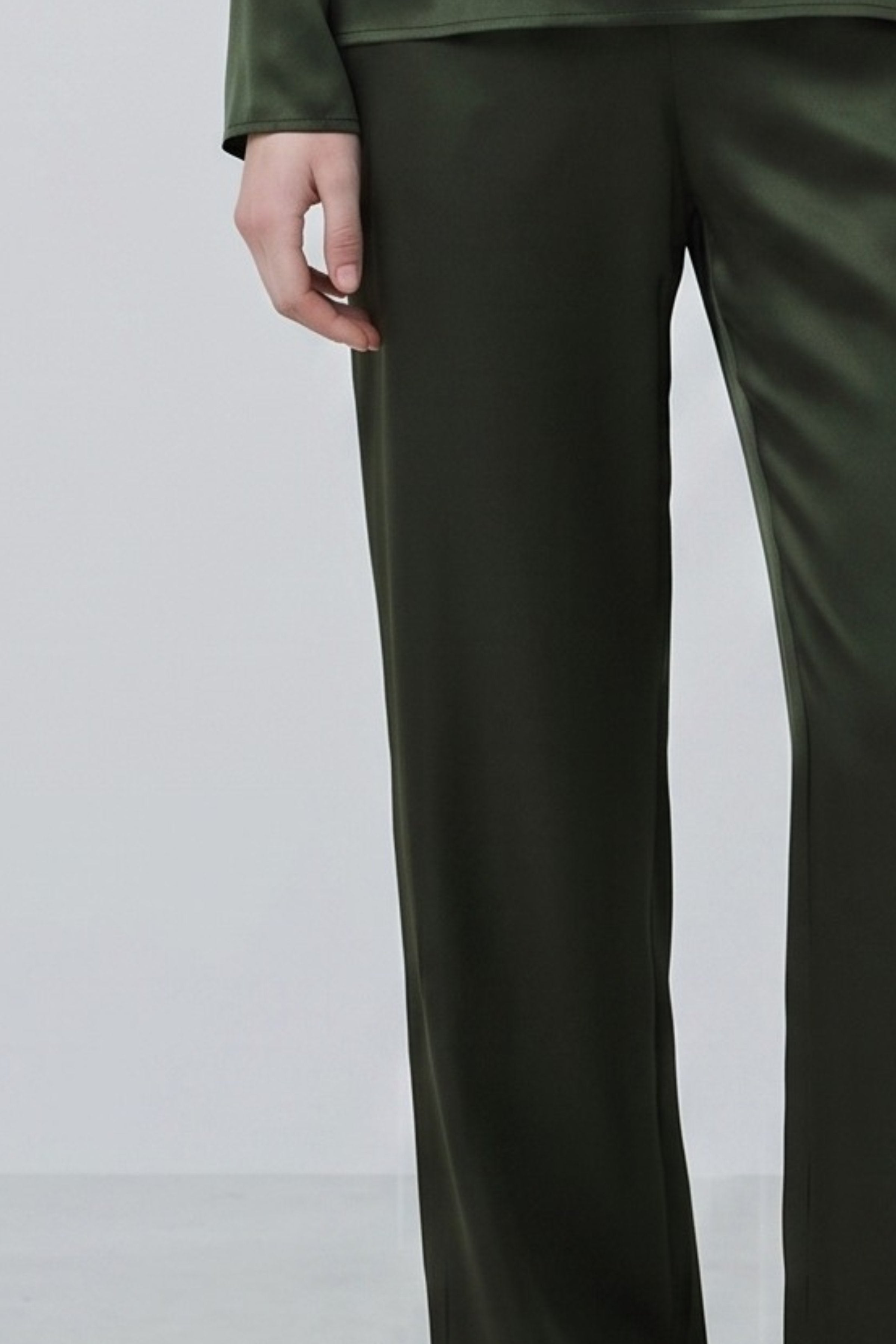 Green organic silk trousers with relaxed fit and elasticated waistband detail