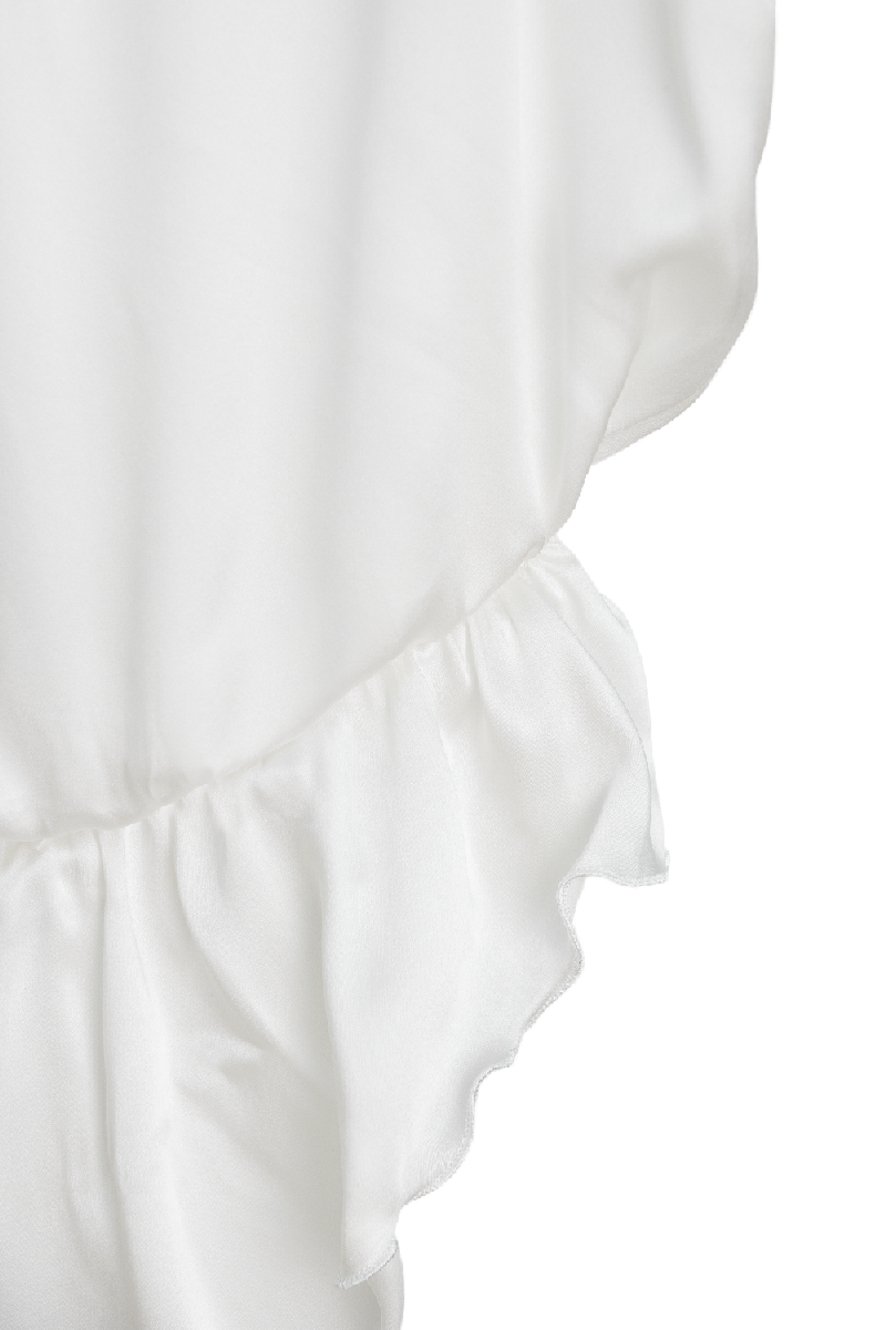 Detail of Nyx ivory organic silk bodysuit fabric and craftsmanship — premium womenswear by HERTH